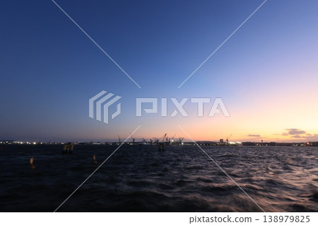 A view of factories in Negishi Port at sunset. A view of factories in Negishi Port at sunset. 138979825