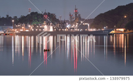 The Japan Maritime Self-Defense Force test ship "Asuka" (ASE-6102) quietly moored at the Yoshikura Pier in Yokosuka at night. 138979975