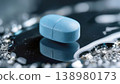 Blue Medical Tablet on Reflective Surface 138980173