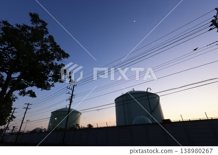 A view of storage tanks in the Negishi industrial complex, at sunset. A view of storage tanks in the Negishi industrial complex, at sunset. 138980267