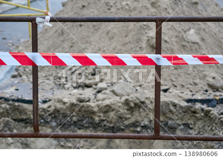 Red white tape,fencing reiling warning of danger during construction,repairs 138980606
