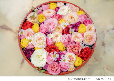 Colorful flowers packed in a sushi tub Colorful flowers packed in a sushi tub 138980955