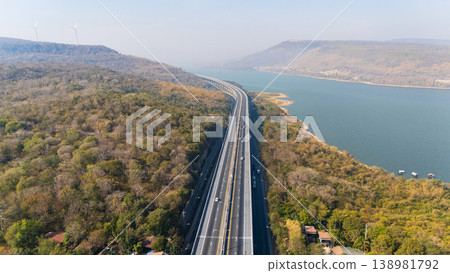 Drone shot aerial view landscape of the M6 motorway Expressway Nakhon Ratchasima Province - Bang Pa-in. Lam Ta Khong River and Mountain. Drone shot of scenic landscape rural place traffic. Nakhon Drone shot aerial view landscape of the M6 motorway Expressway Nakhon Ratchasima Province - Bang Pa-in. Lam Ta Khong River and Mountain. Drone shot of scenic landscape rural place traffic. Nakhon 138981792