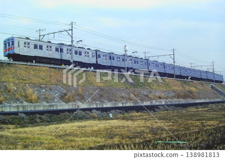 Tokyu Den-en-toshi Line, 8500 series, 8521 and 6 other cars, between Ichigao and Hijigaoka, January 27, 1980, under a wide-open sky. Tokyu Den-en-toshi Line, 8500 series, 8521 and 6 other cars, between Ichigao and Hijigaoka, January 27, 1980, under a wide-open sky. 138981813