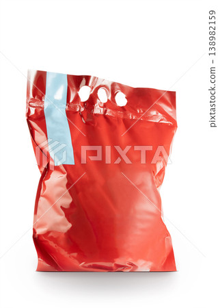 Red blank plastic packaging bag isolated on white background, mockup template for branding, product packaging design, minimal retail container, generic shopping bag concept.  138982159