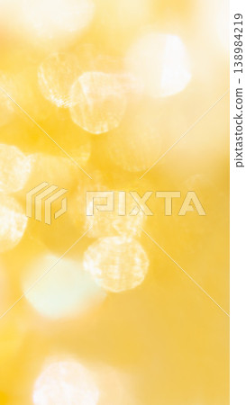A sparkling, fluffy yellow bokeh gradient background. A sparkling, fluffy yellow bokeh gradient background. 138984219