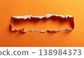 Ripped orange paper background with torn edge texture 138984373