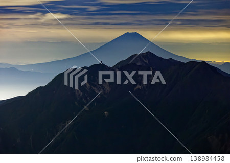Night view of Mt. Fuji and the Houou Sanzan mountain range from Mt. Kai-Komagatake. Night view of Mt. Fuji and the Houou Sanzan mountain range from Mt. Kai-Komagatake. 138984458