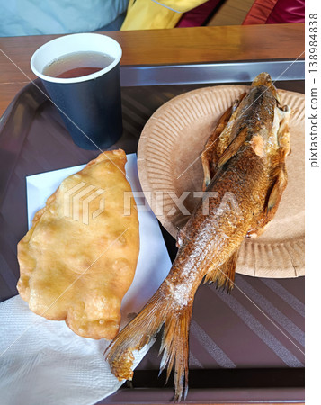 Smoked Fish, Traditional Fried Pastry, and Tea on a Tray Smoked Fish, Traditional Fried Pastry, and Tea on a Tray 138984838