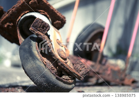 Old, rusty wheels that show the passage of time. Old, rusty wheels that show the passage of time. 138985075