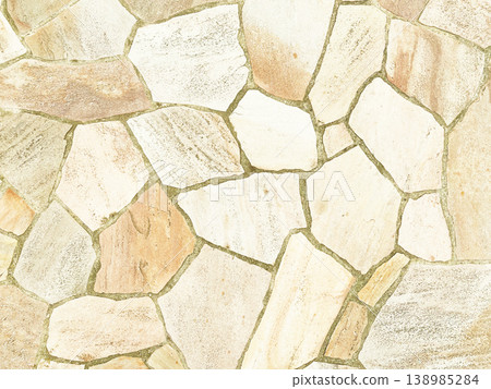 Background image of the surface of irregularly shaped paving stones in a pale yellow color. 138985284