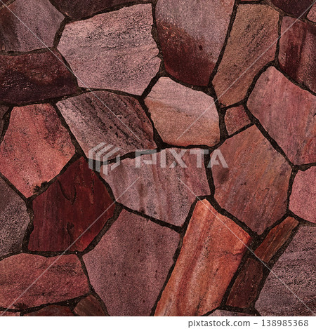 Square background image of the surface of irregularly shaped, reddish-brown paving stones. 138985368