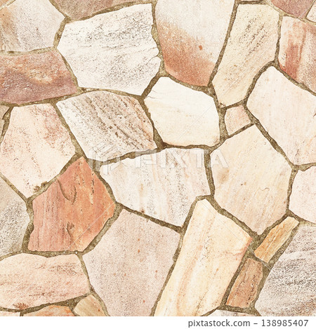 Square background image of the surface of irregularly shaped, light brown paving stones. 138985407