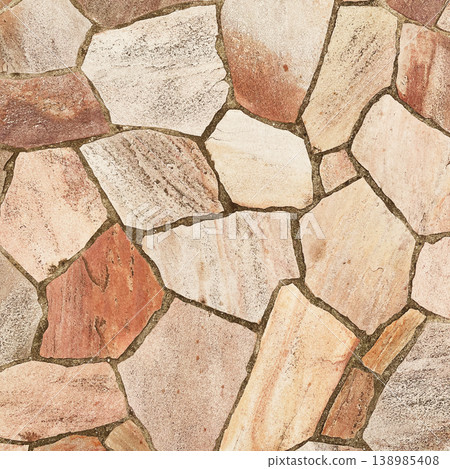 Square background image of a surface with light brown, irregularly shaped paving stones. 138985408