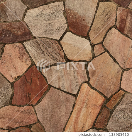 Square background image of a surface with dark light brown, irregularly shaped paving stones. 138985410