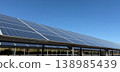 Large Solar Panel Farm Under Clear Blue Sky, Renewable Energy and Sustainable Power Concept 138985439