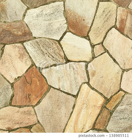 A square background image of the surface of irregularly shaped paving stones in a light yellowish-brown color. 138985511