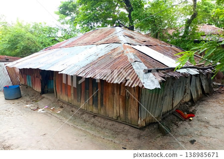 Traditional tin roofed hut in rural area Traditional tin roofed hut in rural area 138985671