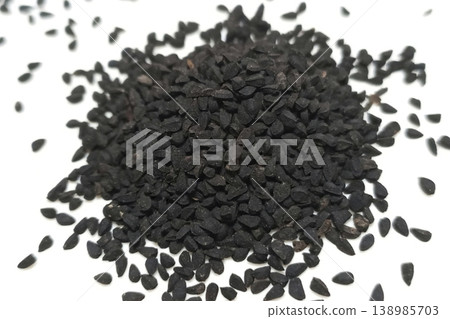 Black cumin seeds pile isolated on white background 138985703