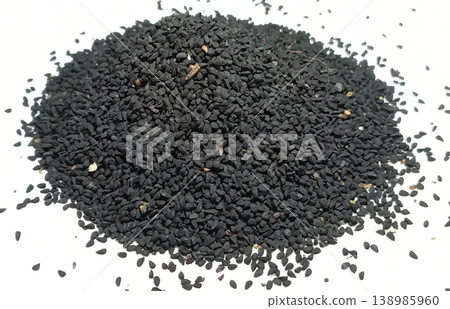Black cumin seeds pile isolated on white background Black cumin seeds pile isolated on white background 138985960