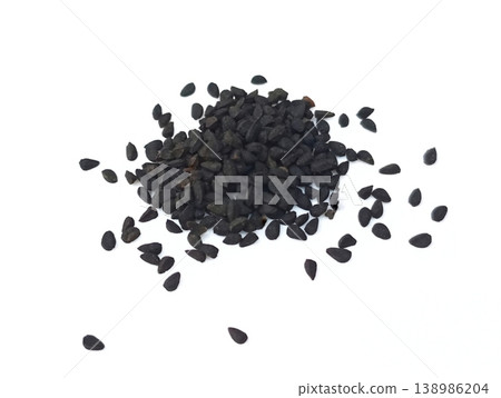 Black cumin seeds pile isolated on white background Black cumin seeds pile isolated on white background 138986204