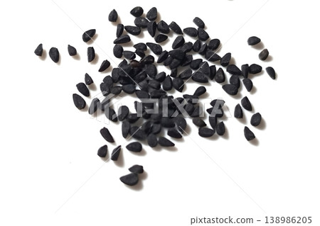 Black cumin seeds pile isolated on white background Black cumin seeds pile isolated on white background 138986205