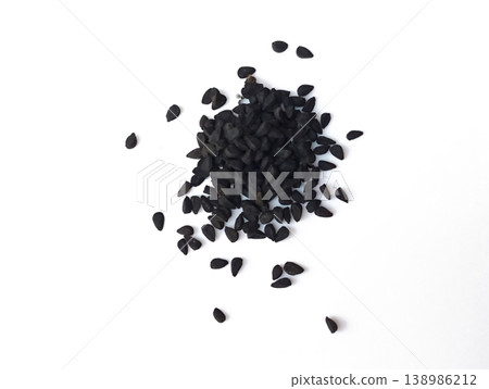 Black cumin seeds pile isolated on white background 138986212