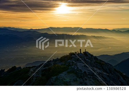 The Kofu Basin and the Daibosatsu mountain range, bathed in the morning sun, as seen from the summit of Mount Kai-Komagatake. The Kofu Basin and the Daibosatsu mountain range, bathed in the morning sun, as seen from the summit of Mount Kai-Komagatake. 138986528
