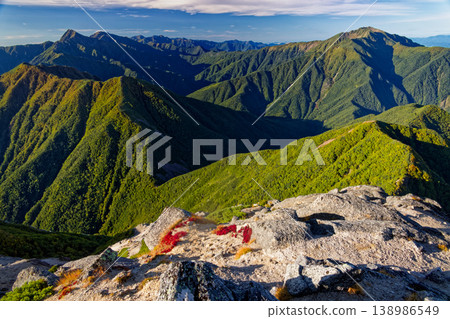 Mount Kitadake and Mount Senjōgatake as seen from the summit of Mount Kaikomagatake in the morning. Mount Kitadake and Mount Senjōgatake as seen from the summit of Mount Kaikomagatake in the morning. 138986549