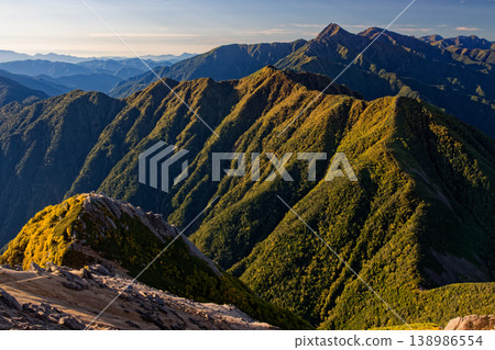 The morning view of Marishiten, Kitadake, and Ainodake from Kai-Komagatake. The morning view of Marishiten, Kitadake, and Ainodake from Kai-Komagatake. 138986554