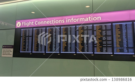 Flight connection information signs at Heathrow Airport 138986816