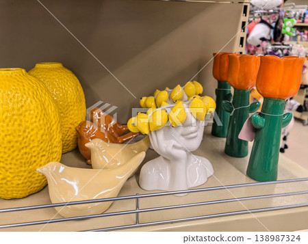 Whimsical ceramic vases and bird figurines on store display Whimsical ceramic vases and bird figurines on store display 138987324