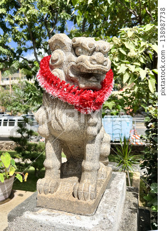 Komainu (guardian lion-dogs) wearing leis from Izumo Taisha Shrine in Hawaii Komainu (guardian lion-dogs) wearing leis from Izumo Taisha Shrine in Hawaii 138987738