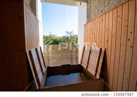 A beautiful view of the blue sky and forest from the open-air bath. Image of a guest room with an open-air bath. A beautiful view of the blue sky and forest from the open-air bath. Image of a guest room with an open-air bath. 138987987