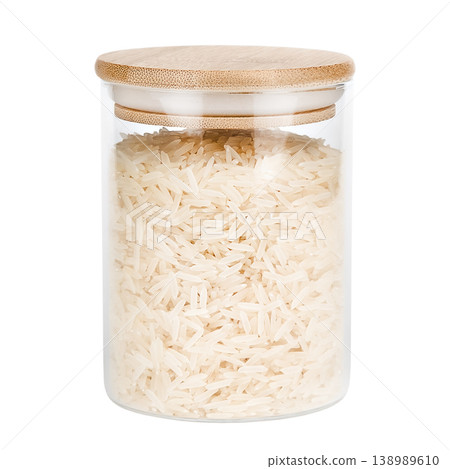 Rice in a glass jar with a wooden lid, isolated on white background Rice in a glass jar with a wooden lid, isolated on white background 138989610