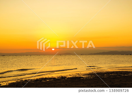 A view of the sunrise from the coast A view of the sunrise from the coast 138989726