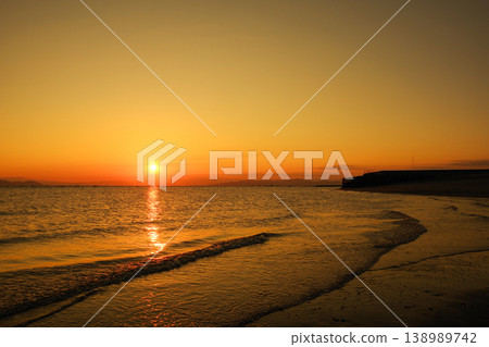 A view of the sunrise from the coast 138989742