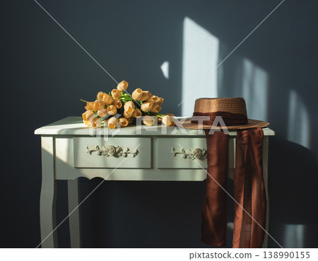 retro table with a hat and tulips on it. retro table with a hat and tulips on it. 138990155