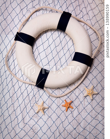 Lifebuoy on a blue grid over white background 138990159