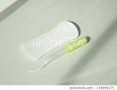 women's hygiene. Pads or tampons. light and shadow women's hygiene. Pads or tampons. light and shadow 138990175