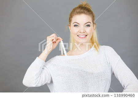 Happy woman holding her bra strap Happy woman holding her bra strap 138990460