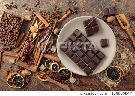 Black chocolate and various spices and seasonings for making aromatic drinks. Black chocolate and various spices and seasonings for making aromatic drinks. 138990947