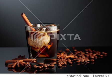 Cocktail of cream and coffee on a black background. Cocktail of cream and coffee on a black background. 138990974