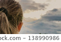 Young Girl Full of Faith, Confident Prayer Pose, Peaceful Childhood Dreaming, Girl Hoping for a Miracle, Spiritual Connection in Nature, Prayer at Dawn, Looking for a Sign, Innocent Trust in the Sky 138990986