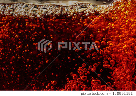 Carbonated drink is poured into a glass. 138991191