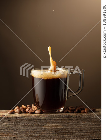 Espresso coffee glass cup with splashes on a brown background. 138991206