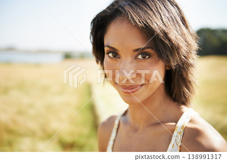 Portrait, relax or happy woman in a field, nature or outdoor park in spring for freedom on break. Smile, wellness or female person in farm for fresh air on holiday vacation or travel in countryside 138991317