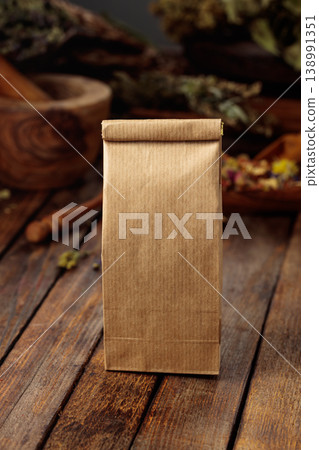 Tall brown paper bag on an old wooden table. Tall brown paper bag on an old wooden table. 138991351