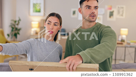 Home, remodeling and couple with frame for interior design, planning and renovation in apartment. Love, dating and man and woman with picture for creativity, decoration and DIY project in living room Home, remodeling and couple with frame for interior design, planning and renovation in apartment. Love, dating and man and woman with picture for creativity, decoration and DIY project in living room 138991362