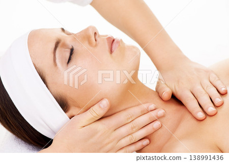 Hands, relax and massage with a woman customer closeup in a studio isolated on a white background. Face, spa and wellness with a young person in a salon for physical therapy or skincare treatment Hands, relax and massage with a woman customer closeup in a studio isolated on a white background. Face, spa and wellness with a young person in a salon for physical therapy or skincare treatment 138991436
